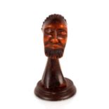 An African carved wooden bust, of a gentleman having closed eyes and elongated neck on later