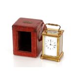 A brass cased carriage timepiece, having white enamel Roman numeral dial, leather travelling case,