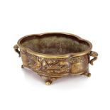 A Chinese bronze censer, of shaped oval form decorated with geese and foliage on scrolled feet, 21cm