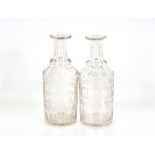 A pair of 19th Century etched glass decanters, with vine and leaf decorated, one inscribed "Brown