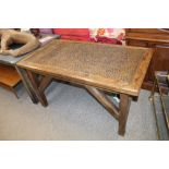 An oak and hammered copper topped Arts & Crafts style dining table, raised on square section