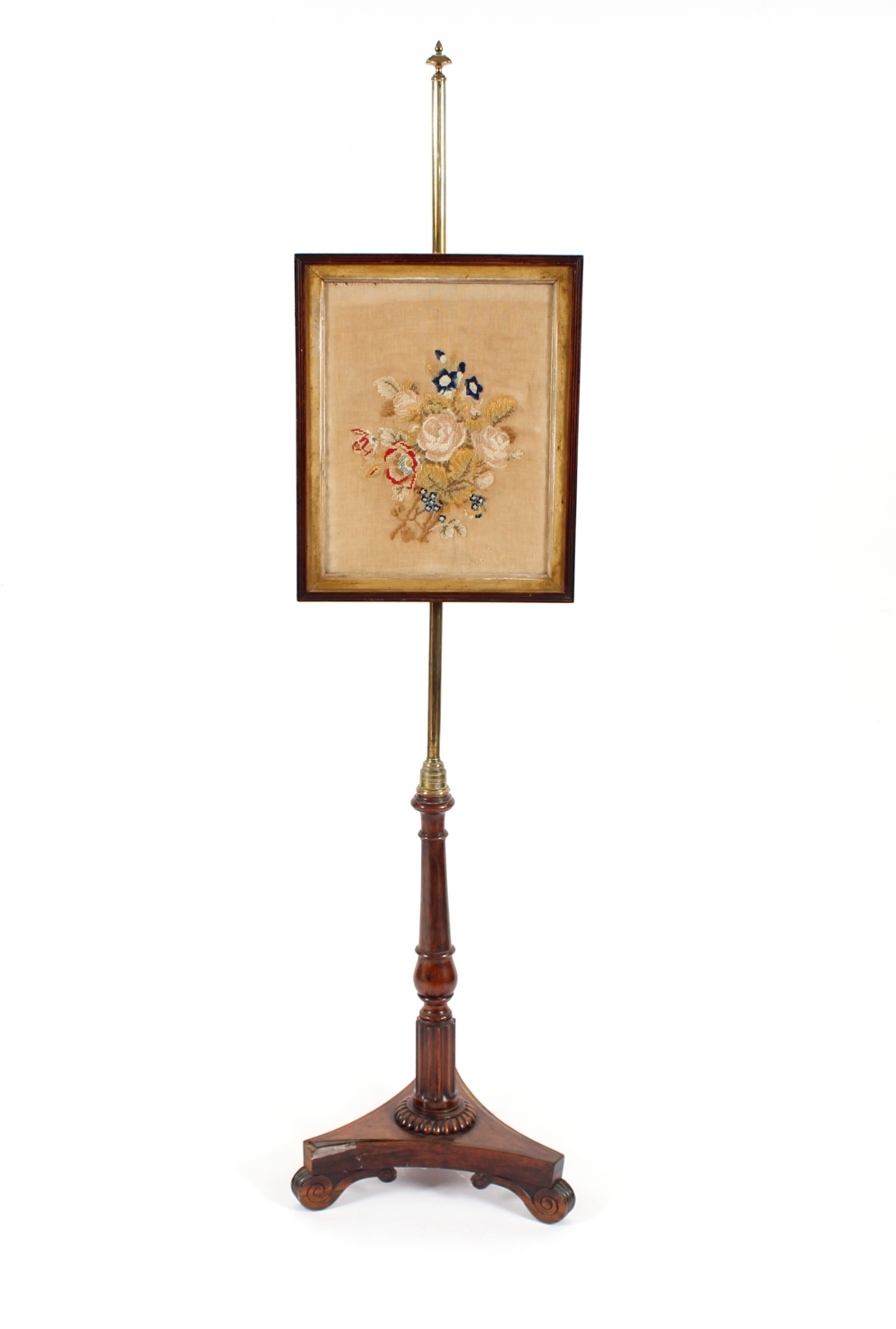A 19th Century rosewood and brass pole screen, having embroidered banner raised on turned fluted