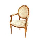 A gilt three piece salon suite, comprising settee and matching elbow chairs with tied ribbon