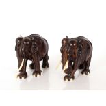 A pair of Oriental hardwood and ivory elephants, 2