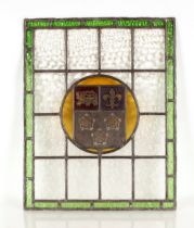A 19th Century stained glass and leaded window panel, having central heraldic crest, 64cm x 51cm