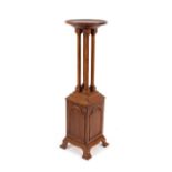 An unusual oak four column plant stand, surmounted by a circular dished top, the base fitted with