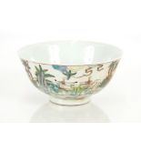 A Chinese famille verte bowl, decorated figures in a garden, underglaze blue six character mark to