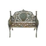 A green painted cast iron garden seat, of small proportions having foliate and bird decorated