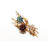 A 9ct gold and diamond set brooch, of floral spray