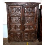 A 17th Century Breton Armoire, the interior shelves enclosed by a pair of panelled doors naively