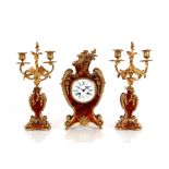 A tortoiseshell and gilt metal mounted French clock garniture, AF the clock having enamel Roman