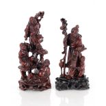 A Chinese carved Hongmu group, depicting Shoulou with staff, attendant child and stork with