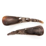 Two Ethnographic carved horn scoops, each with stylised figure head terminals, pierced body and