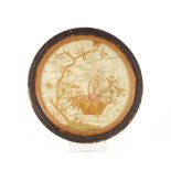 A 19th Century silk embroidered circular panel, in painted and gilt frame, 27.5cm overall