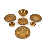 A collection of early 20th Century Chinese bronze and brass bowls and trays, decorated with