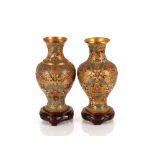 A near pair of early / mid 20th Century Chinese gilt metal and relief cloisonné vases, of baluster