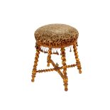 A 19th Century French gilt wood dressing stool, raised on spiral turned supports, the circular