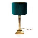 A brass Corinthian column table lamp, with green shade, 52cm high