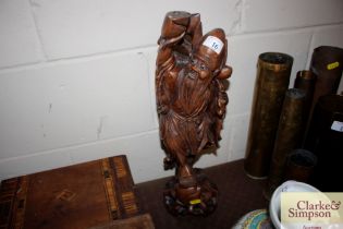 A Chinese carved hardwood figure of a sage