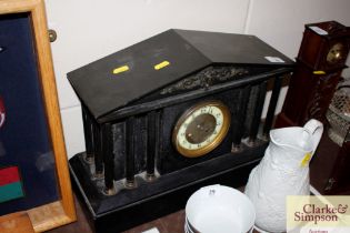 A large Victorian marble and slate mantel clock in