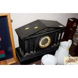 A large Victorian marble and slate mantel clock in