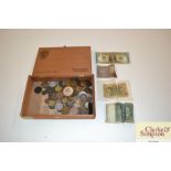 A wooden cigar box of mixed coinage and notes
