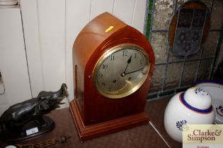 An Edwardian mahogany cased mantel clock having ei
