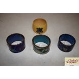 A collection of three cloisonné napkin rings and a
