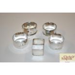 Five various silver napkin rings