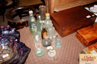 A collection of assorted vintage glass bottles etc