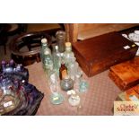 A collection of assorted vintage glass bottles etc