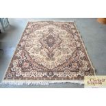 An approximate 8'7" x 4'5" floral wool rug