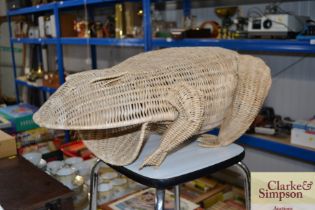 A wicker basket in the form of a frog