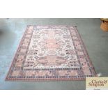 An approximate 6'5" x 4'9" Eastern patterned rug