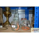 A quantity of glass storage jars