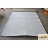 An approximate 9'1" x 6' wool rug