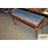 A duet piano stool for re upholstery raised on cab
