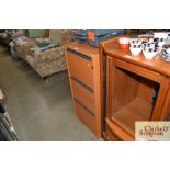 A wood effect three drawer filing chest