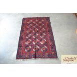 An approximate 4'3" x 2'8" New Baluchi rug