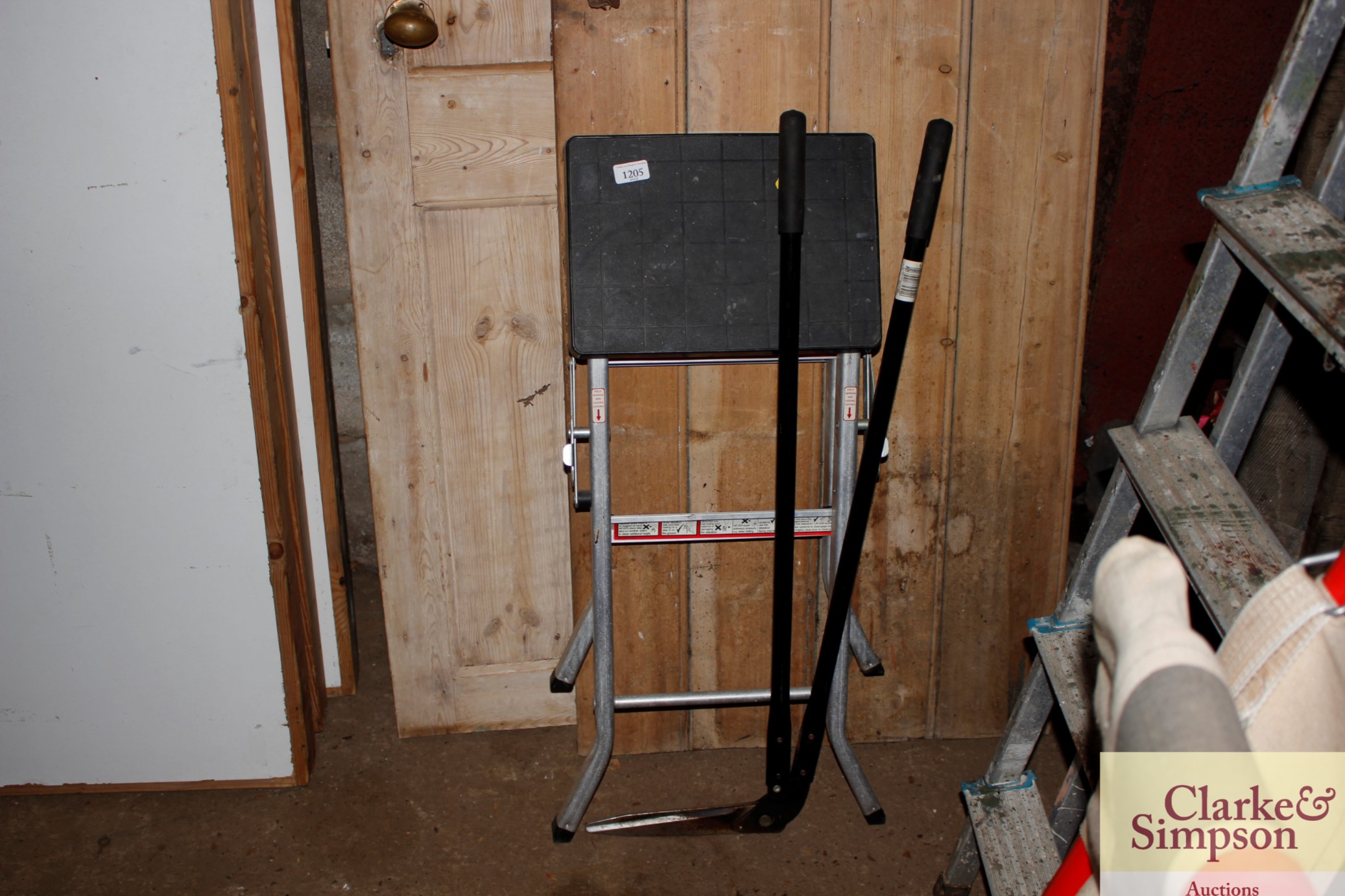 A step stool and a pair of garden edgers