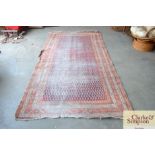 An approximate 9'6 x 3'10" red patterned runner (v