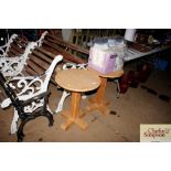 A pair of pine based circular occasional tables