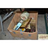 A box of various vintage tins