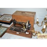 A Frister & Rossmann sewing machine with fitted ca
