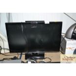 A Samsung flat screen television with remote contr