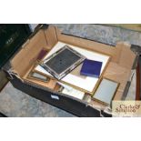 A box containing various picture frames