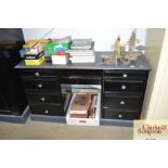 A pine eight draw ebonised dressing table