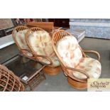 Three cane swivel chairs