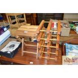 A small hardwood folding table and a wine rack