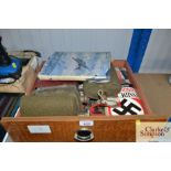 A box containing various military items to include